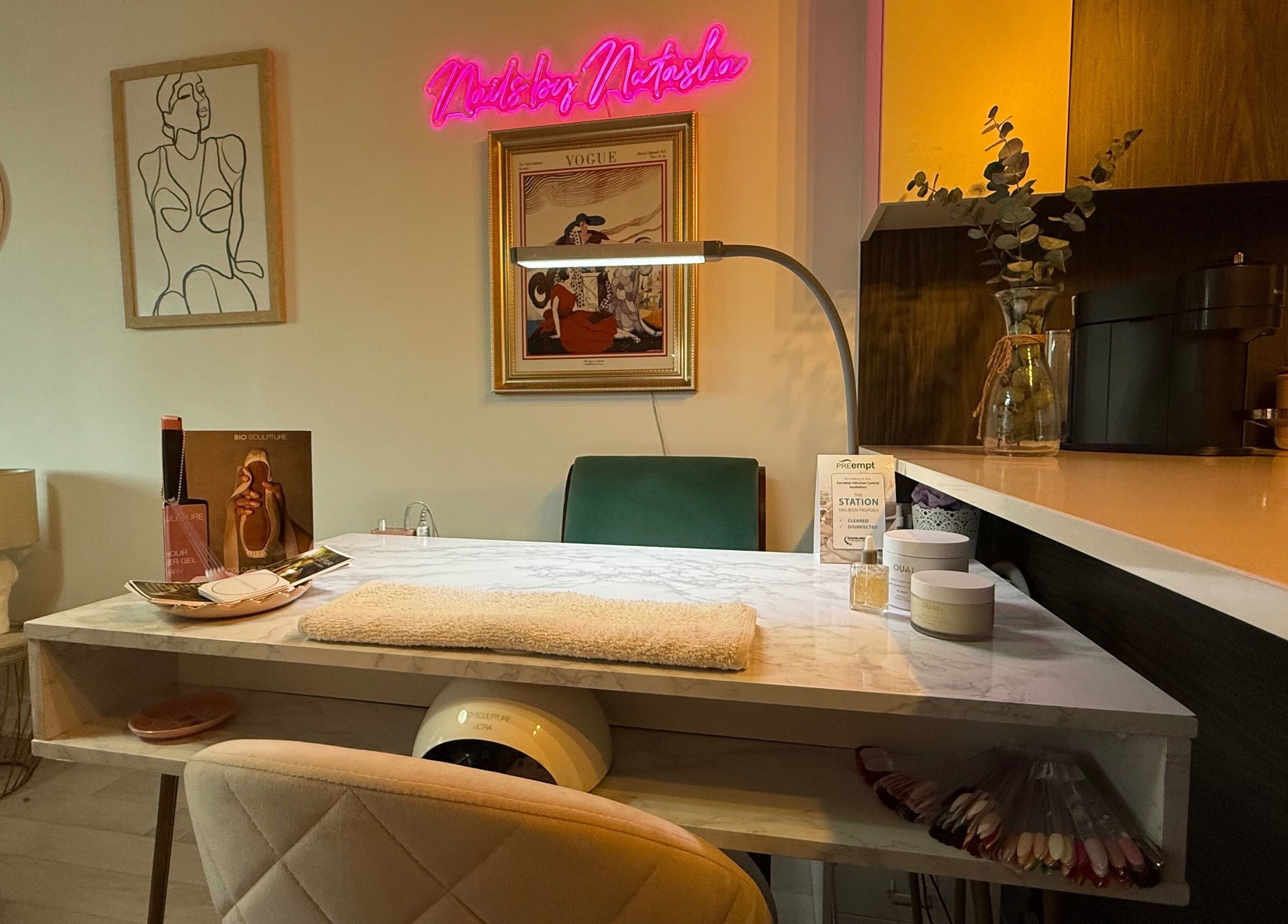 Cozy nail station at Nails By Natasha in Dorval, Quebec, CA with elegant decor and ambient lighting.