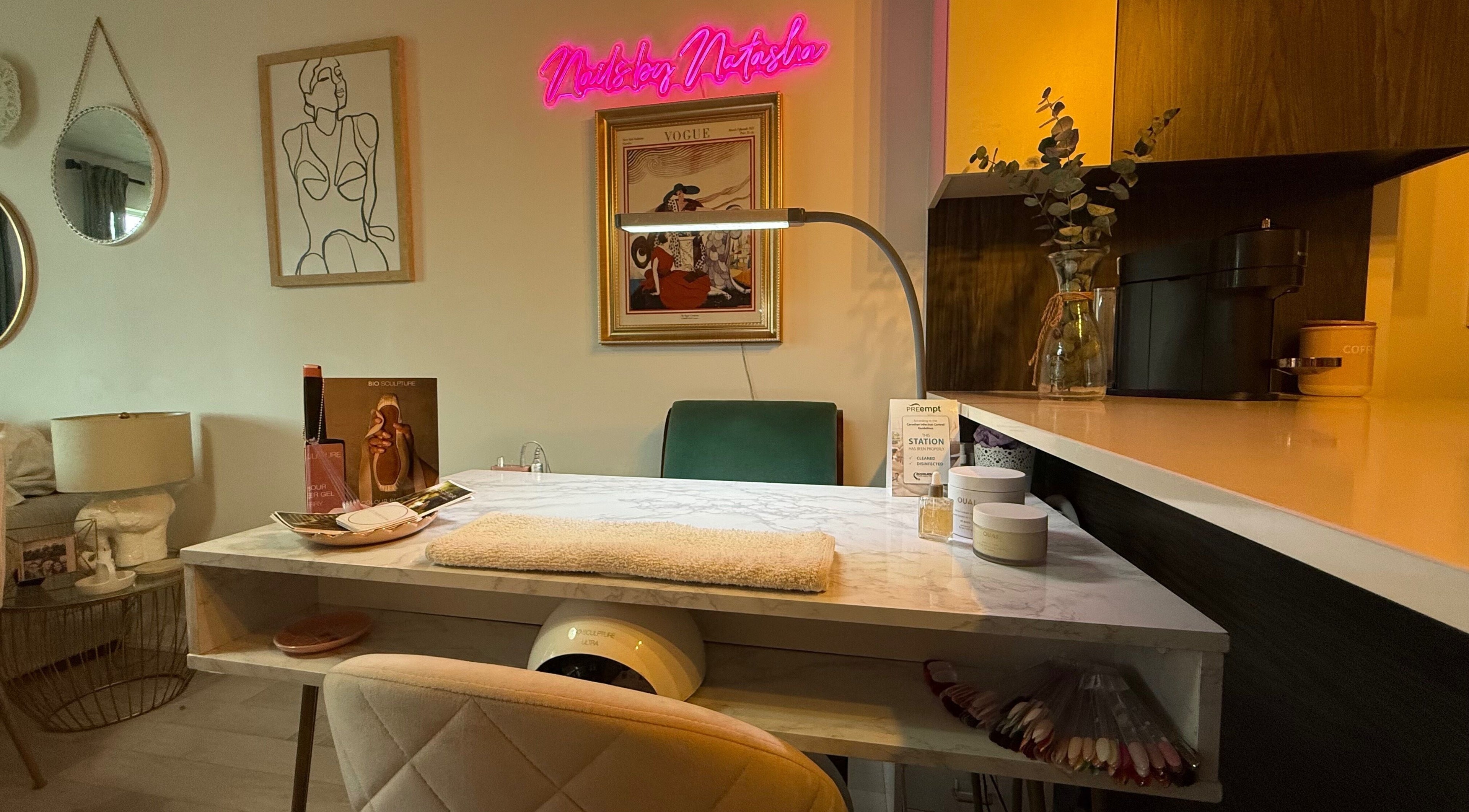 Cozy nail station at Nails By Natasha in Dorval, Quebec, CA with elegant decor and ambient lighting.