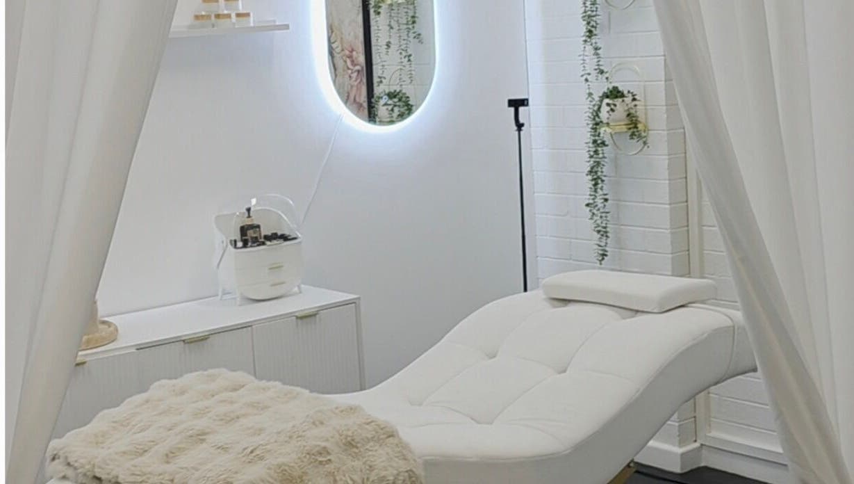 The Derma Lab's tranquil treatment room in Mandurah, Western Australia, AU, featuring a plush white chair.