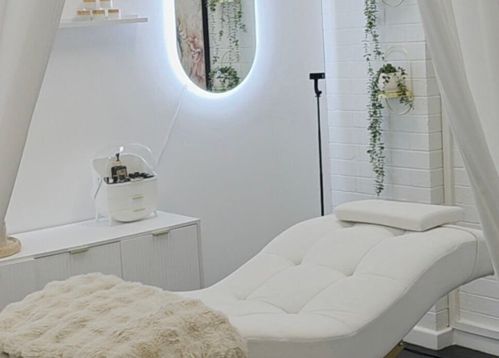 The Derma Lab's tranquil treatment room in Mandurah, Western Australia, AU, featuring a plush white chair.