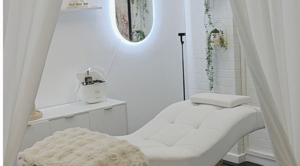 The Derma Lab's tranquil treatment room in Mandurah, Western Australia, AU, featuring a plush white chair.