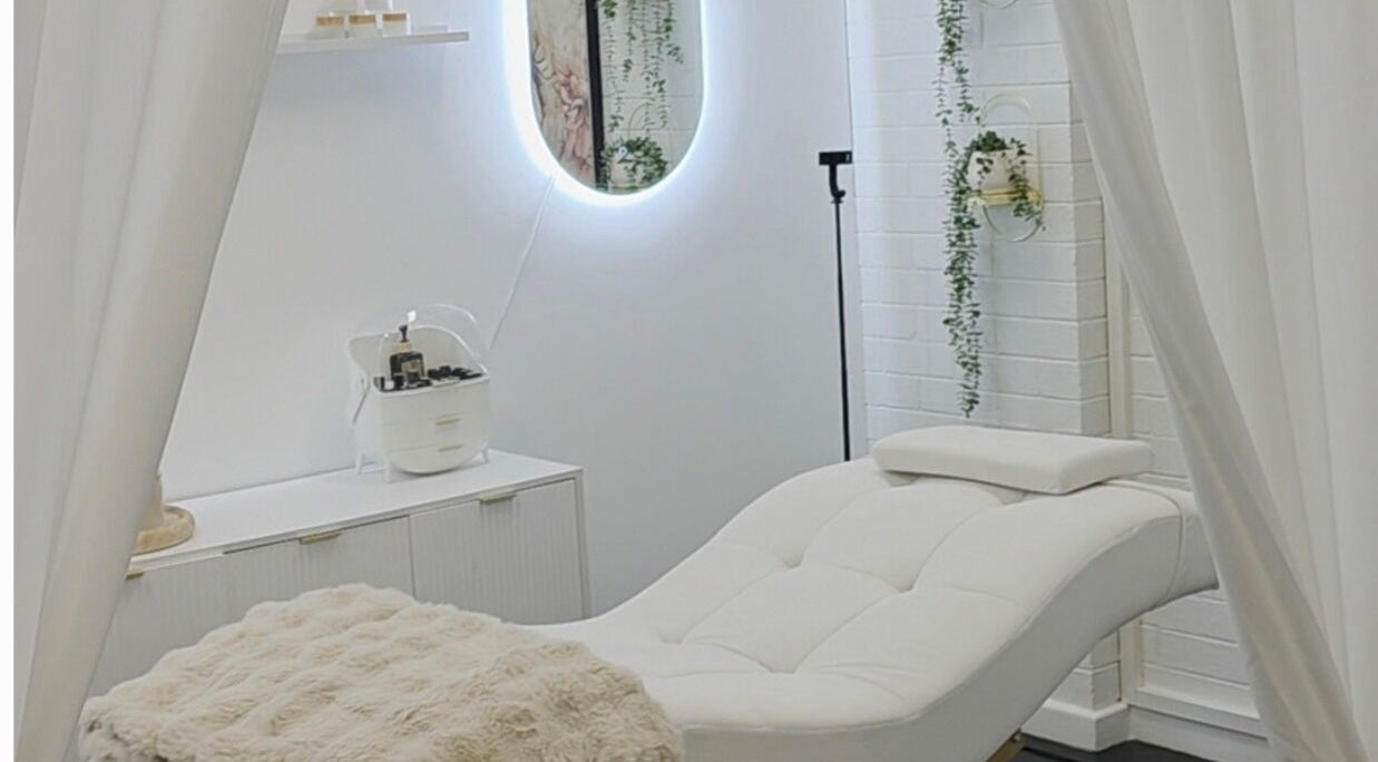 The Derma Lab's tranquil treatment room in Mandurah, Western Australia, AU, featuring a plush white chair.