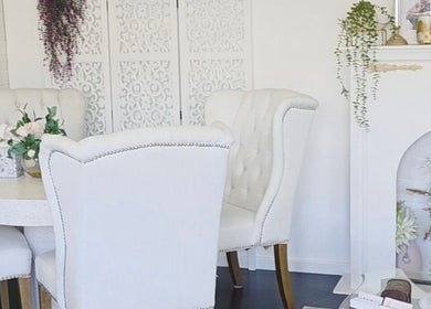 Elegant seating area at The Derma Lab, Mandurah, Western Australia, AU with white chairs and floral decor.