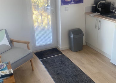 Relaxing space at Boisdale Wellness - Reflexology by Seonaid, Portree, Scotland, GB, featuring a comfy chair.