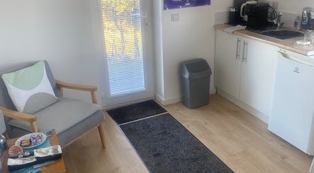 Relaxing space at Boisdale Wellness - Reflexology by Seonaid, Portree, Scotland, GB, featuring a comfy chair.