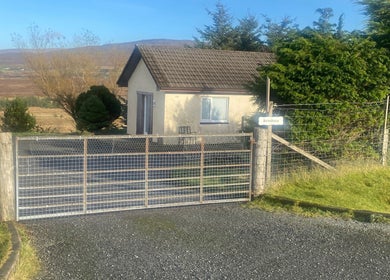 Exterior of Boisdale Wellness - Reflexology by Seonaid in Portree, Scotland, GB, nestled in serene nature.