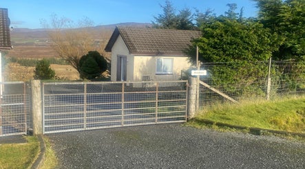 Exterior of Boisdale Wellness - Reflexology by Seonaid in Portree, Scotland, GB, nestled in serene nature.