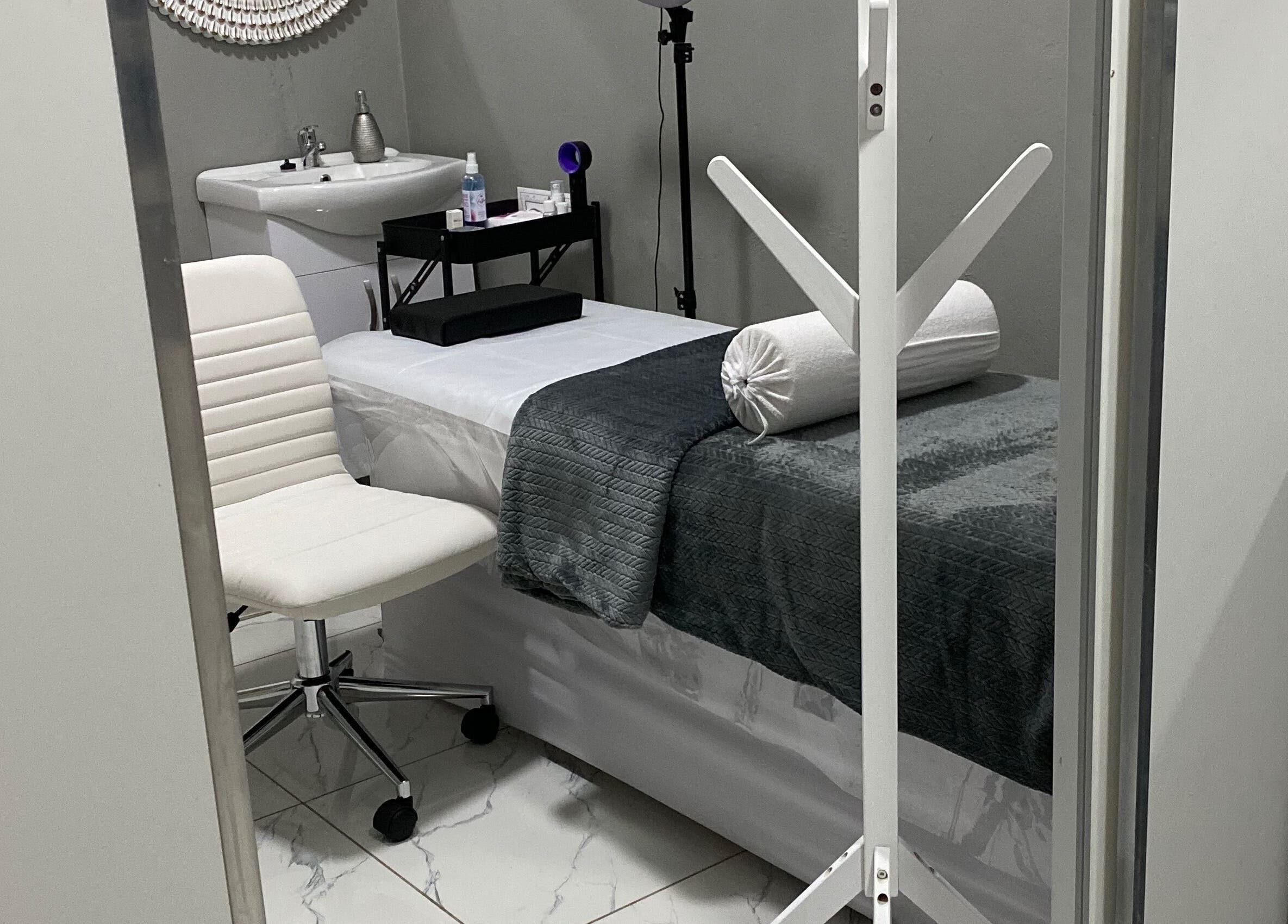 Tranquil treatment room at Ash Ed Beauty Suite, Germiston, Gauteng, ZA with massage bed and elegant decor.