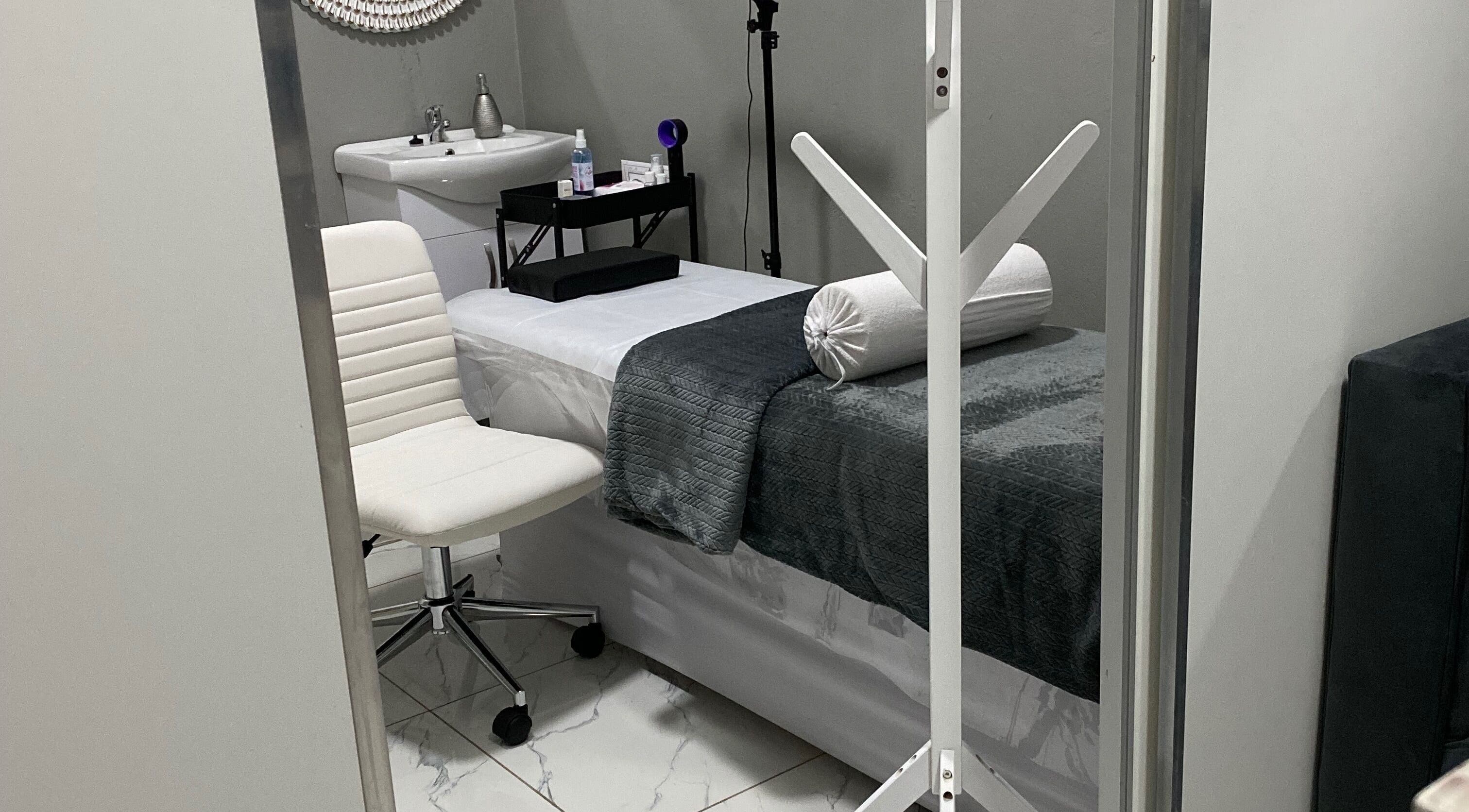 Tranquil treatment room at Ash Ed Beauty Suite, Germiston, Gauteng, ZA with massage bed and elegant decor.