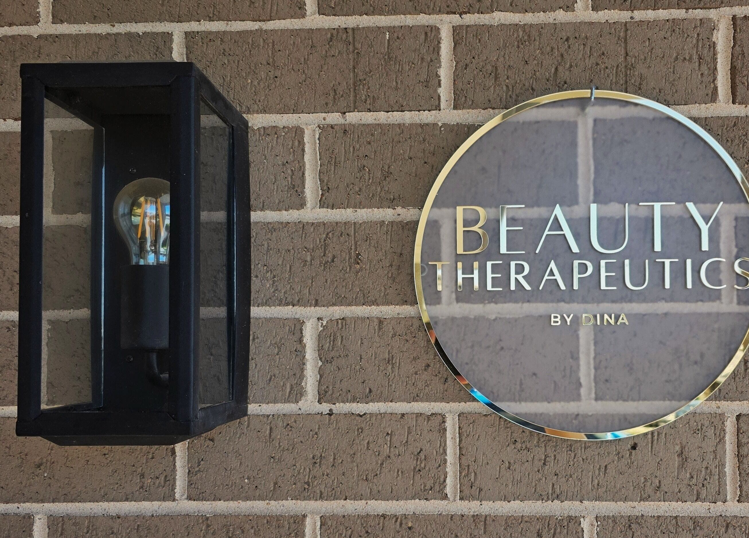 Beauty Therapeutics signage on brick wall, Oran Park, New South Wales, AU.