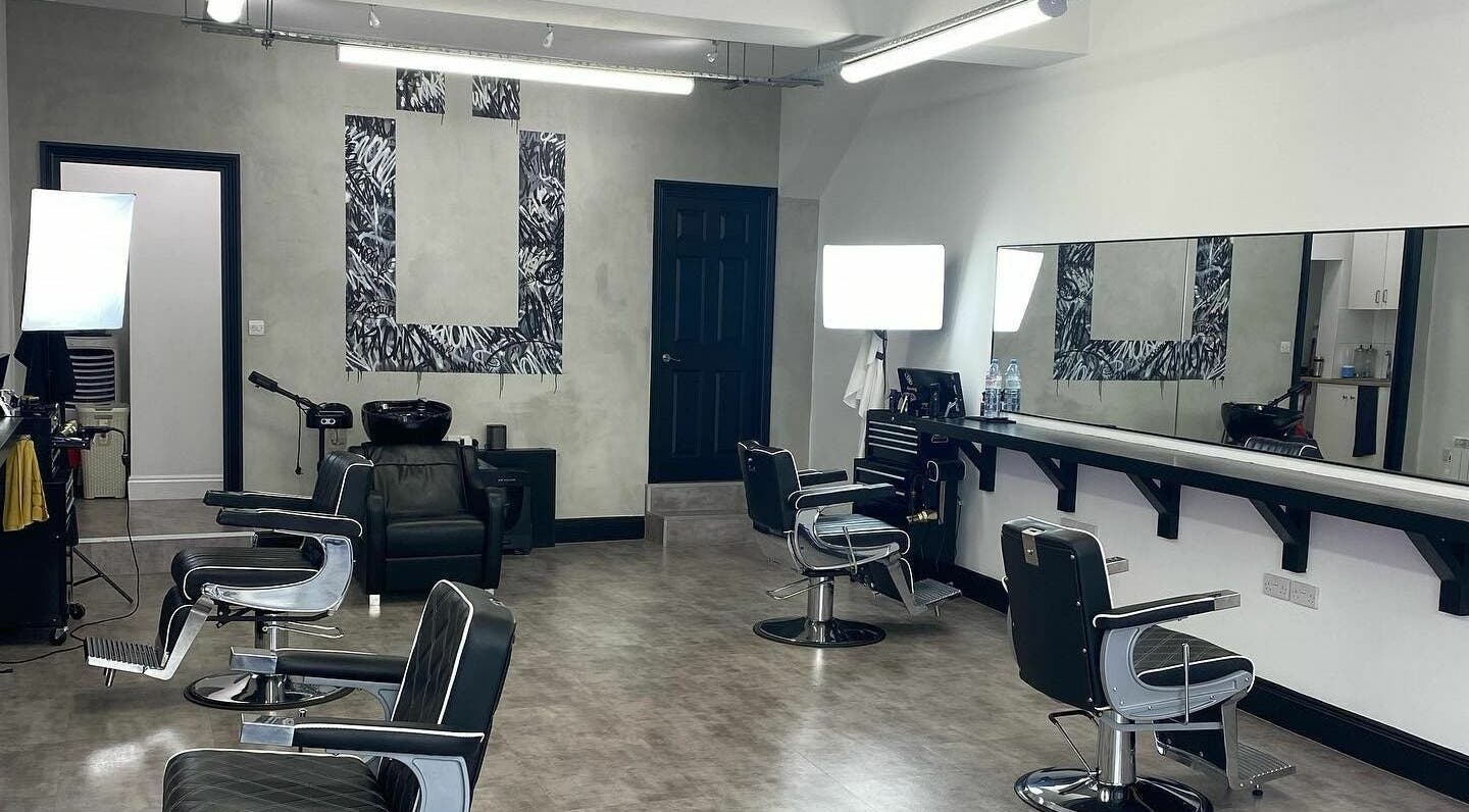 Ünknown Barbers in Guernsey, Saint Peter Port features a modern, stylish interior with sleek barber chairs.