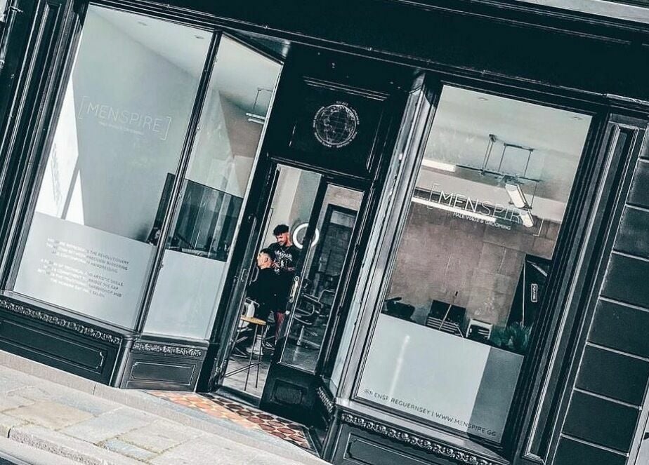 Stylish exterior of Ünknown Barbers in Guernsey, Saint Peter Port, GG, showcasing modern design.