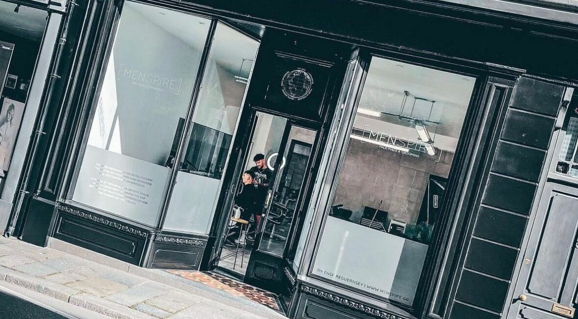 Stylish exterior of Ünknown Barbers in Guernsey, Saint Peter Port, GG, showcasing modern design.