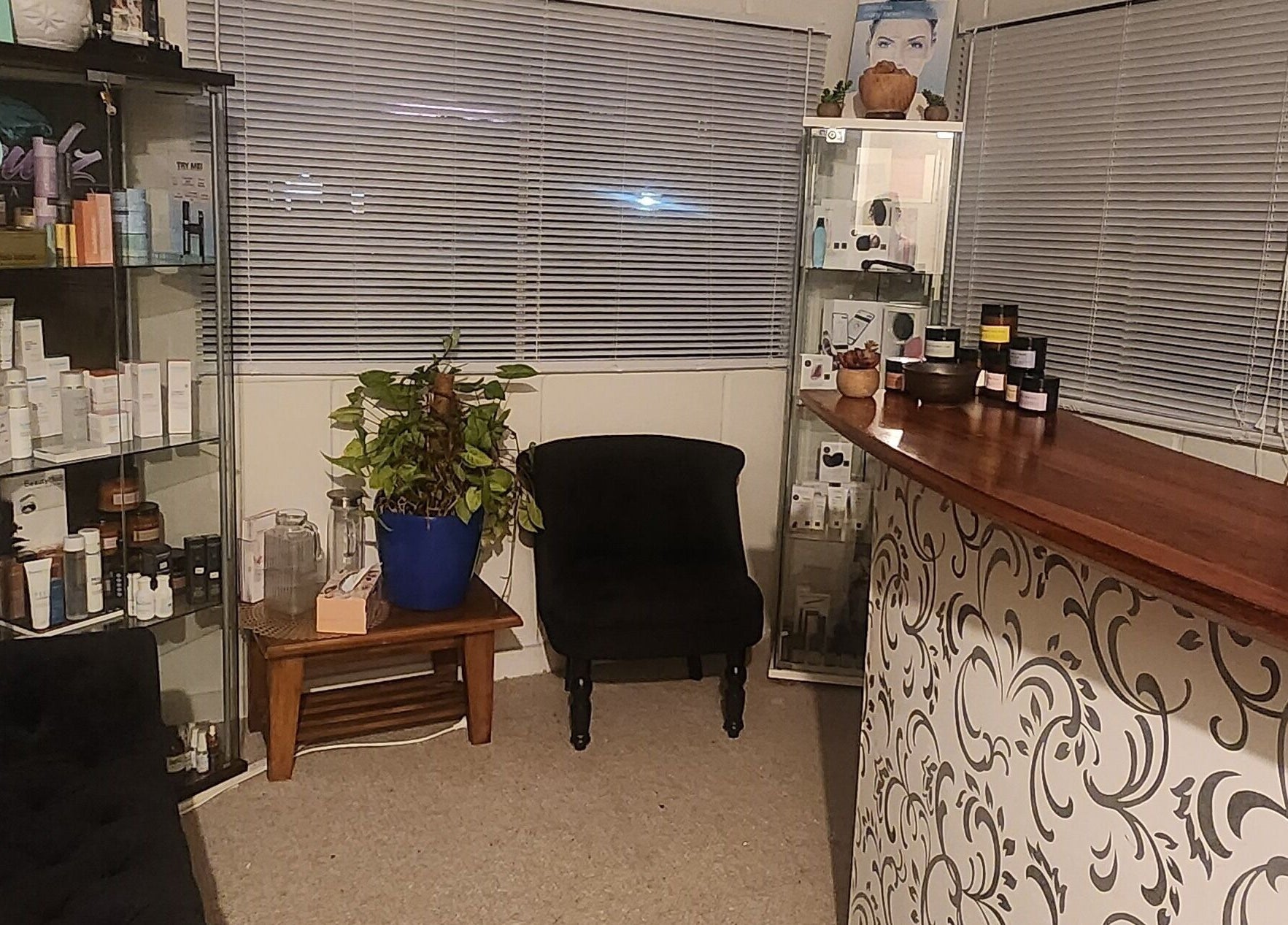 Reception area of Jewlz Beauty, Palmerston North, NZ, showcasing elegant decor and product display.