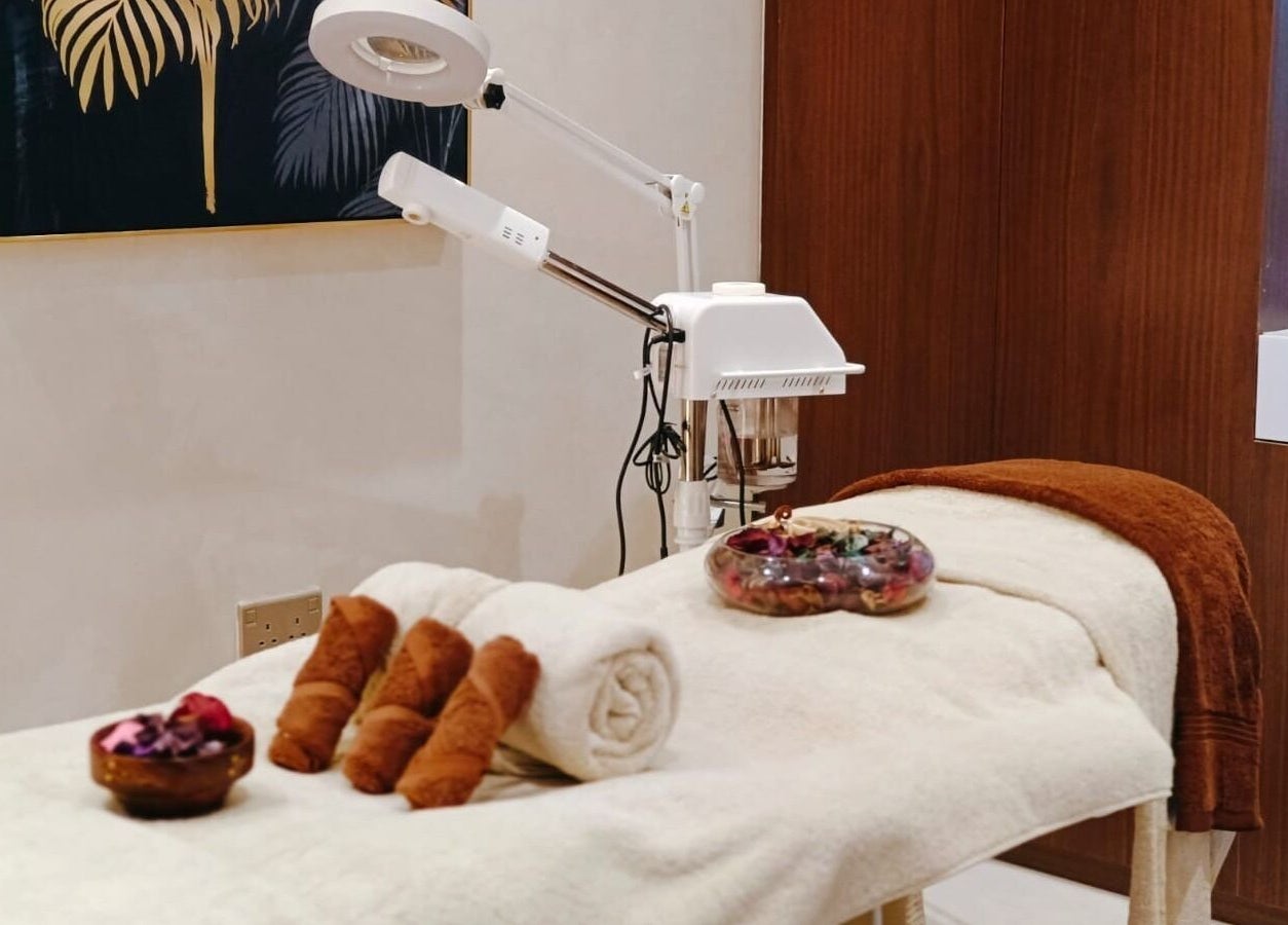 Relaxing treatment room at Healing Zone Spa, Sharjah, AE with a massage table and spa equipment.