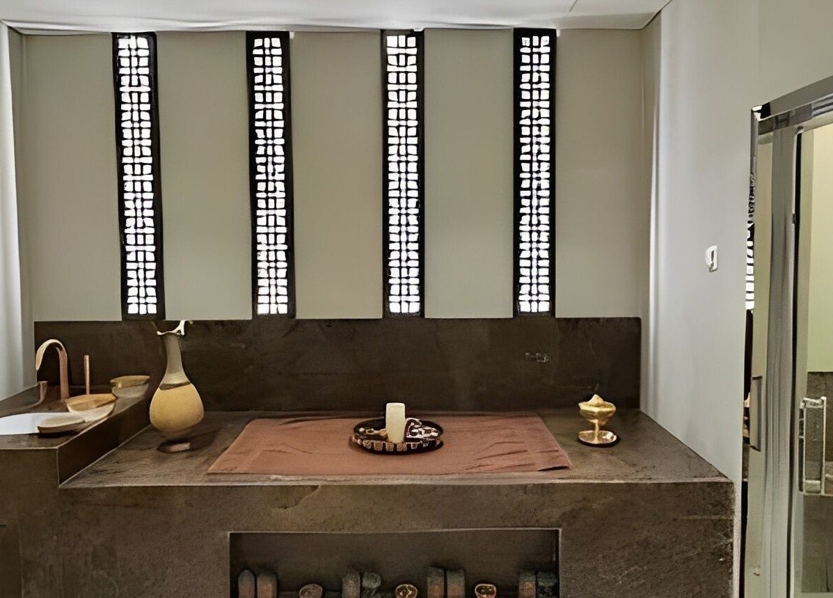 Elegant spa treatment room at Healing Zone Spa in Sharjah, AE with ambient lighting and soothing decor.