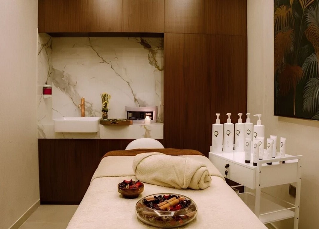 Relaxing treatment room at Healing Zone Spa, Sharjah, AE, featuring a cozy massage table and calming decor.