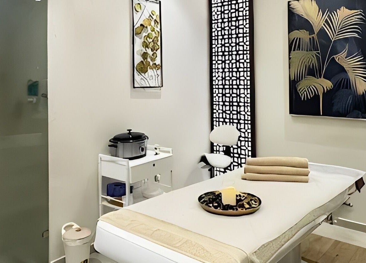 Tranquil massage room at Healing Zone Spa, Sharjah, AE featuring elegant decor and cozy ambiance.