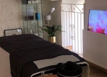 Relaxing treatment room at Zen Botanica, Barry, Wales, GB with massage table and soothing decor.
