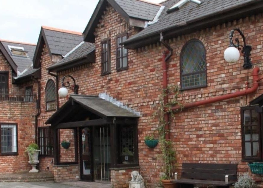 Exterior view of Zen Botanica, a rustic brick building in Barry, Wales, GB, ideal for wellness and beauty services.