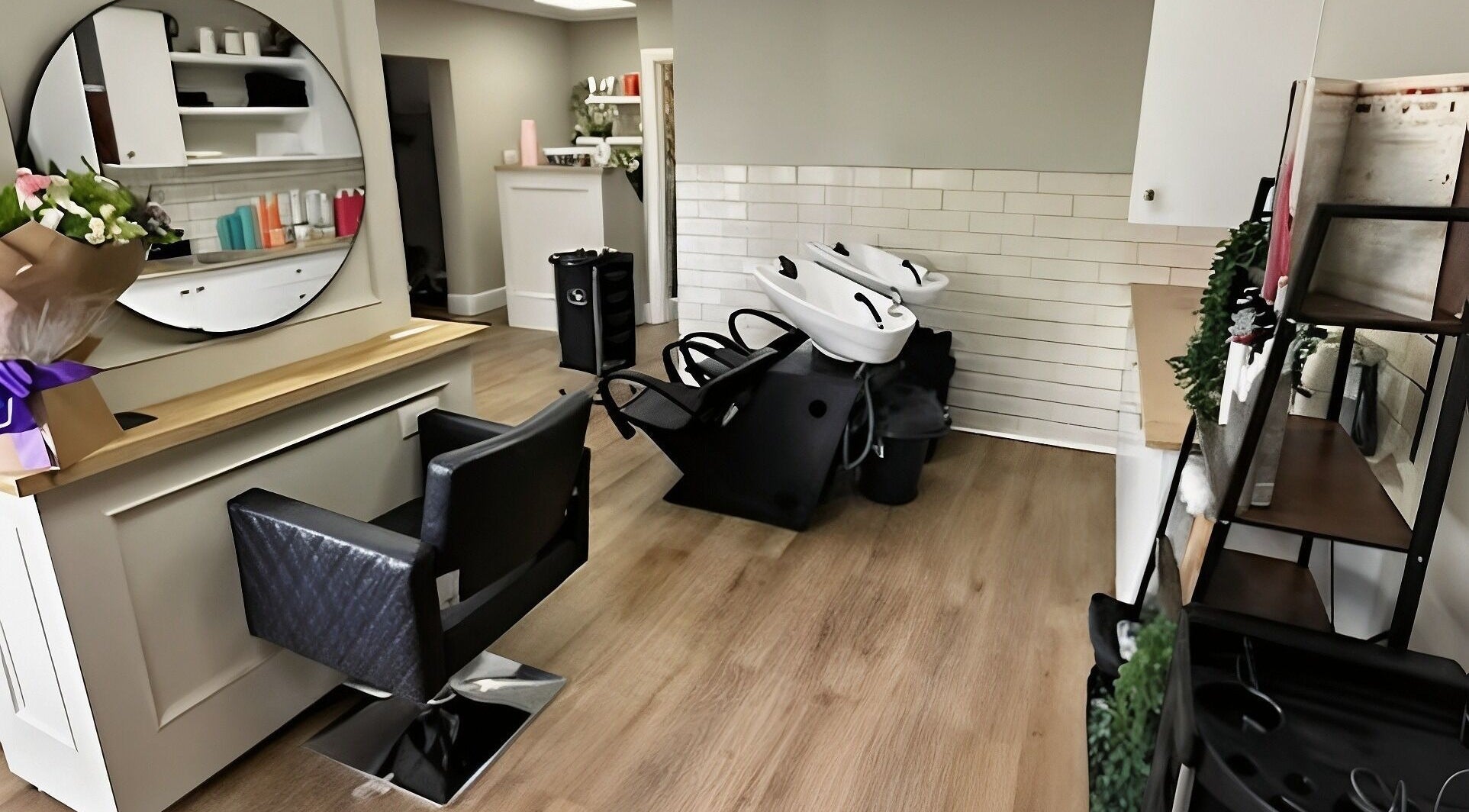 Modern salon interior at Hair Retreat & Co in Waterlooville, England, GB with stylish decor and washing stations.