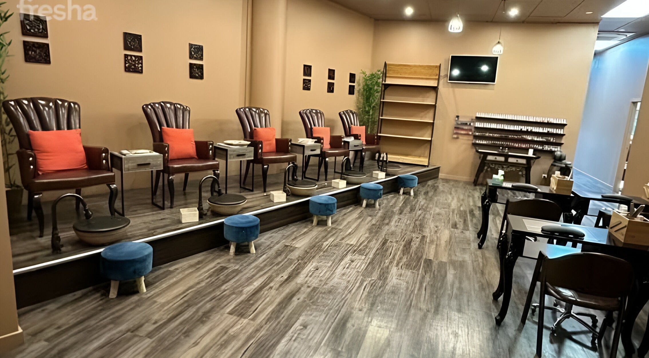 Sophisticated pedicure area at Nv Infinity in Auckland, NZ, with plush chairs and modern decor.