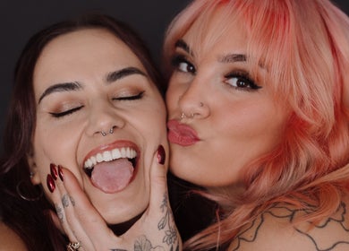 Two people smiling at Bold Beauty Esthetics, Oklahoma City, Oklahoma, US, showcasing vibrant hairstyles and makeup.