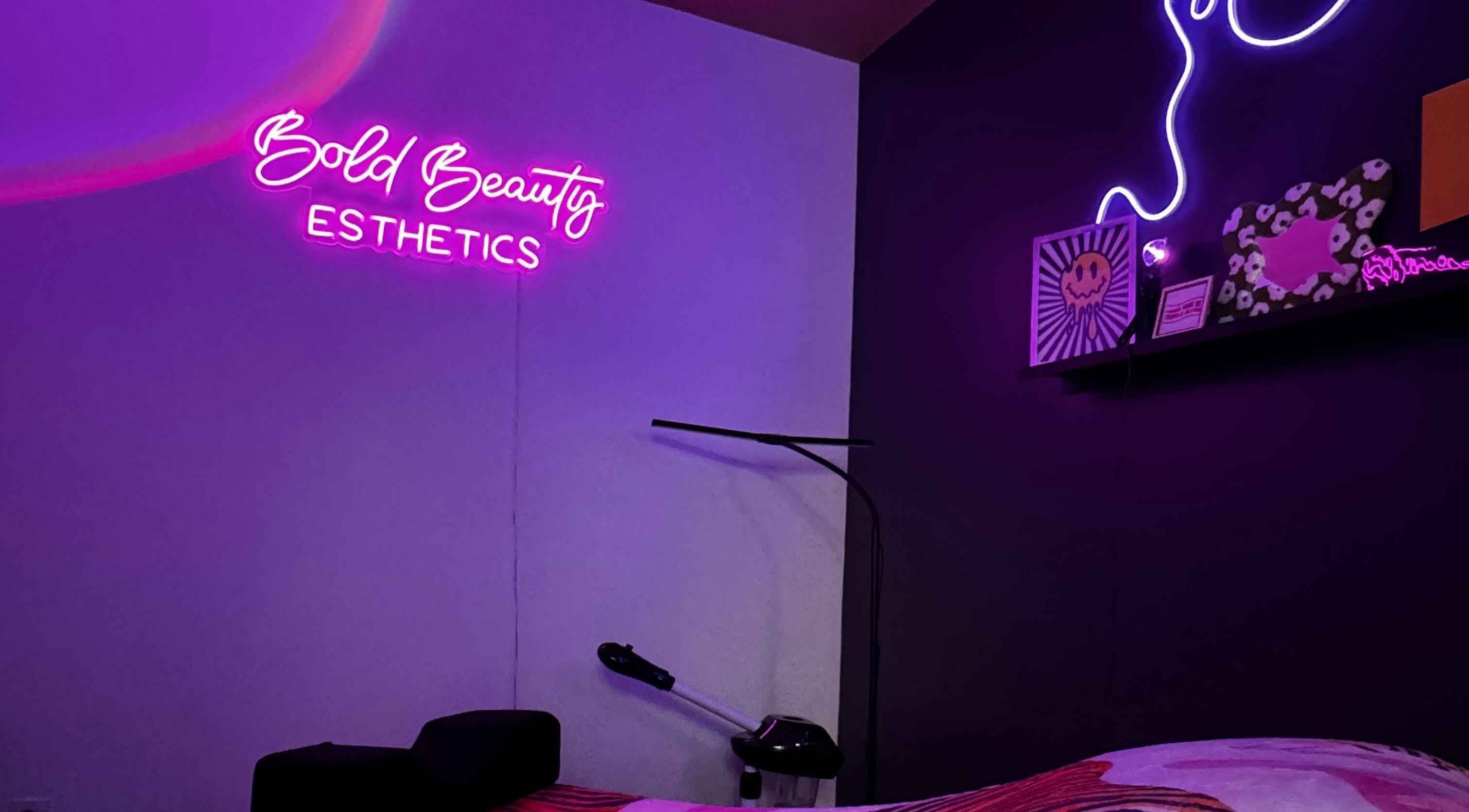 Bold Beauty Esthetics in Oklahoma City, Oklahoma, US, features cozy decor with vibrant neon signage.