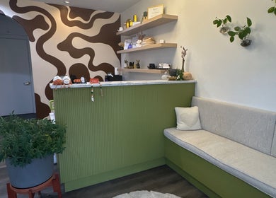 Reception area at Bold Beauty Esthetics, Oklahoma City, showcasing modern decor and seating.