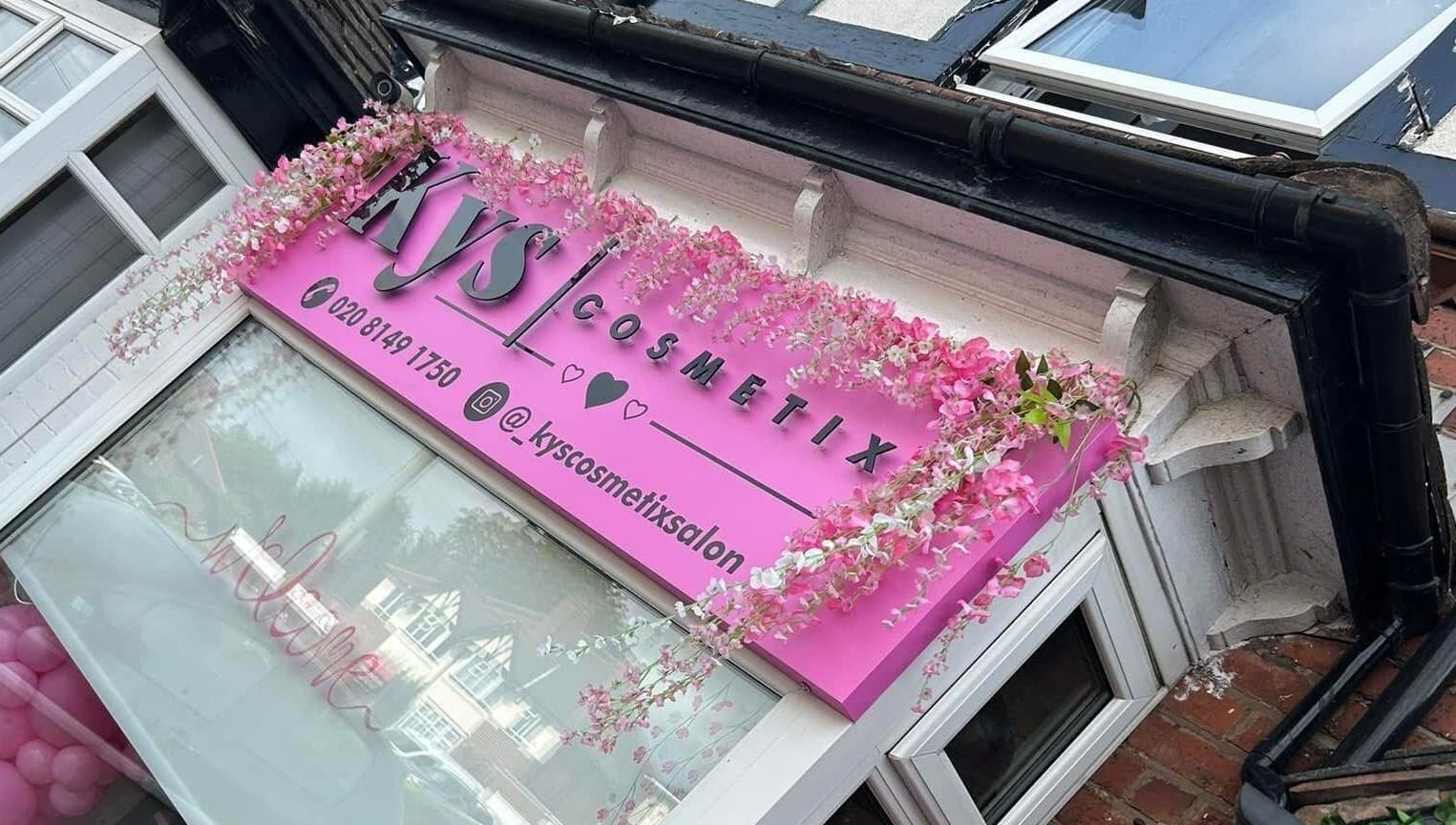 Exterior close-up of Cc Styled It venue in Birmingham, England, GB with floral decoration.