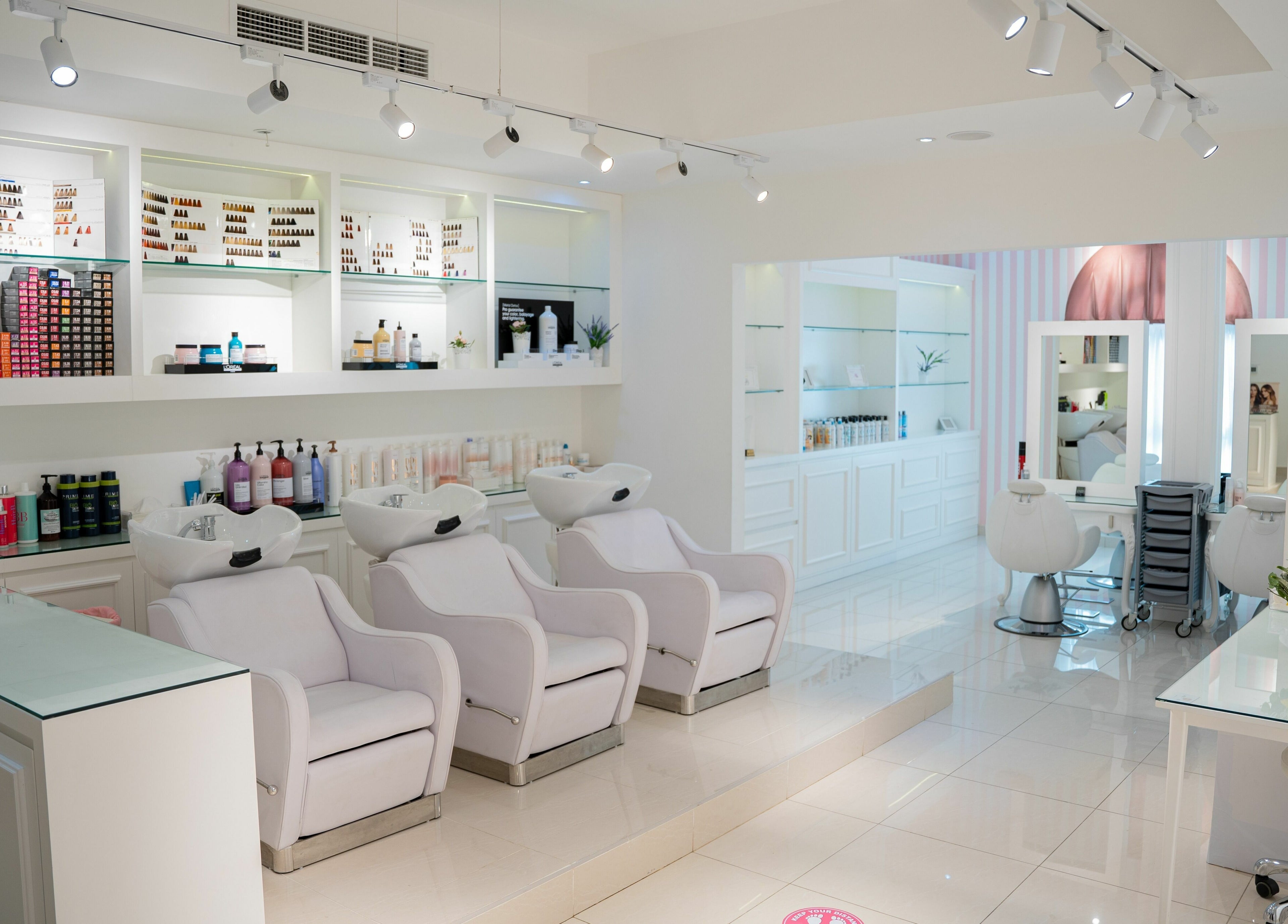 Interior of Shatha Beauty Centre in Sharjah, AE. Features elegant salon chairs and products on display.