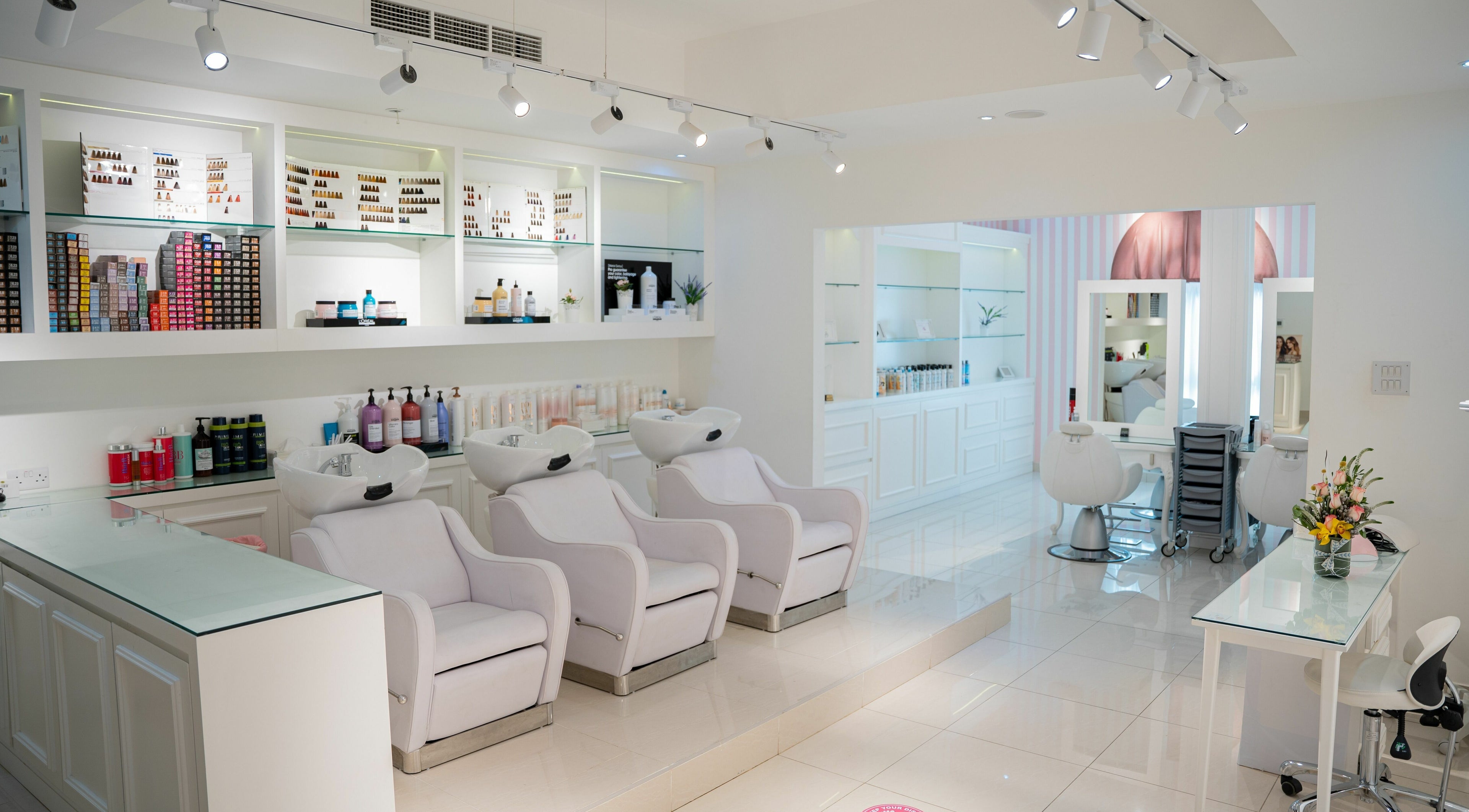 Interior of Shatha Beauty Centre in Sharjah, AE. Features elegant salon chairs and products on display.