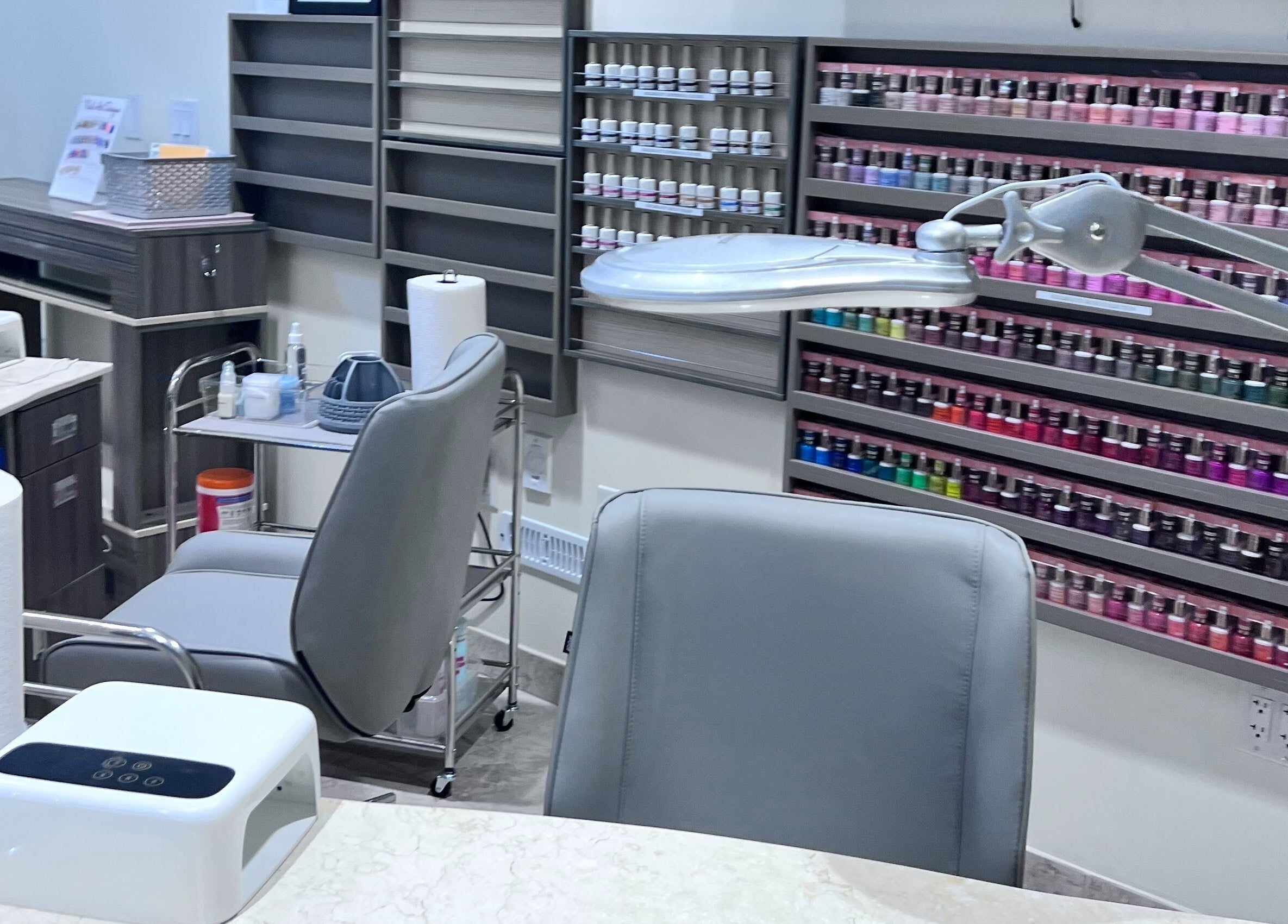 Tat's Nails Central Phoenix showcases its sleek nail station with vibrant polish selection. Phoenix, Arizona, US.