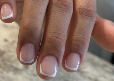 Close-up of elegant French manicure at Tat's Nails Scottsdale, Scottsdale, Arizona, US.