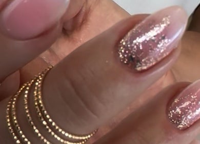 Sparkling pink gel nails with glitter at Tat's Nails Scottsdale, Scottsdale, Arizona, US.