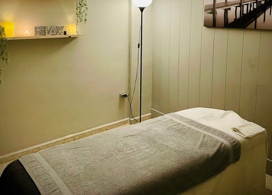 Cozy massage room at Tranquil Massage Fuengirola, Fuengirola, Andalucía, ES. Soft lighting and relaxing decor.