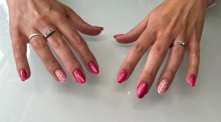 Elegant pink nails with polka dot design, styled at Melodysnailbiz, Aylesford, England, GB.