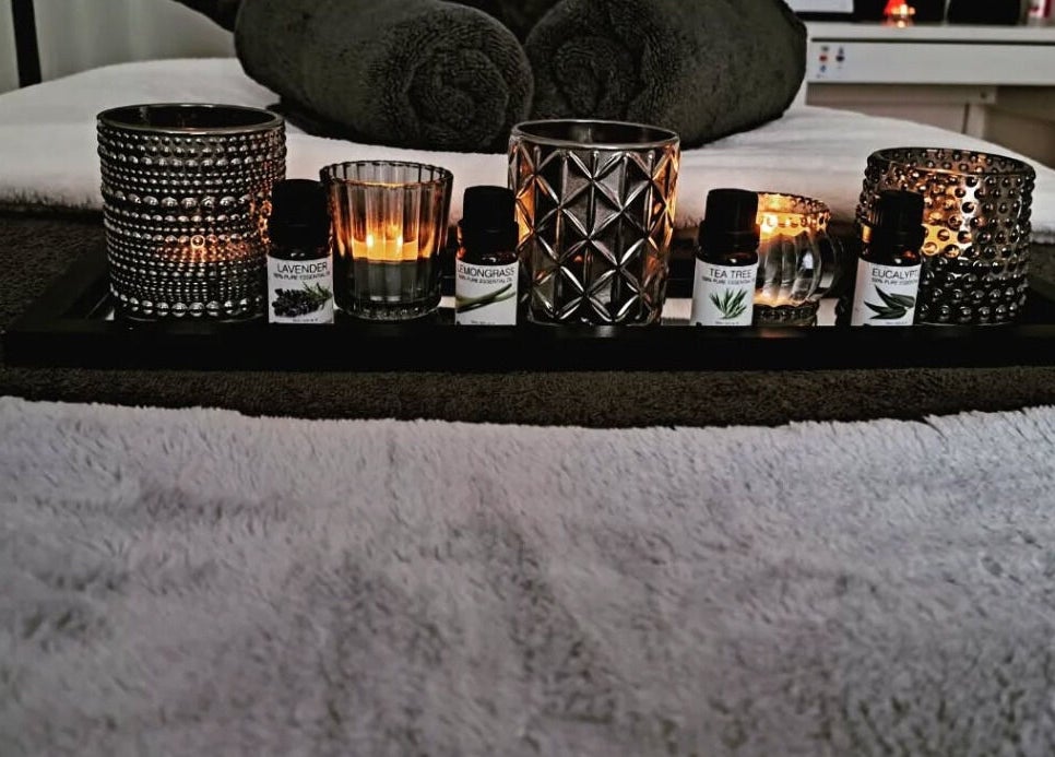 Relaxing aromatherapy setup at JH Specialised Waxing, Carrickmines, County Dublin, IE, featuring essential oils and candles.