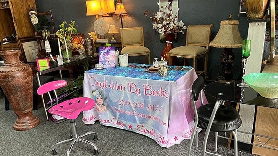 Cozy setup at AngelHairBarbie-Golf4Less in Fort Myers, Florida, US showcasing stylish seating and decor.