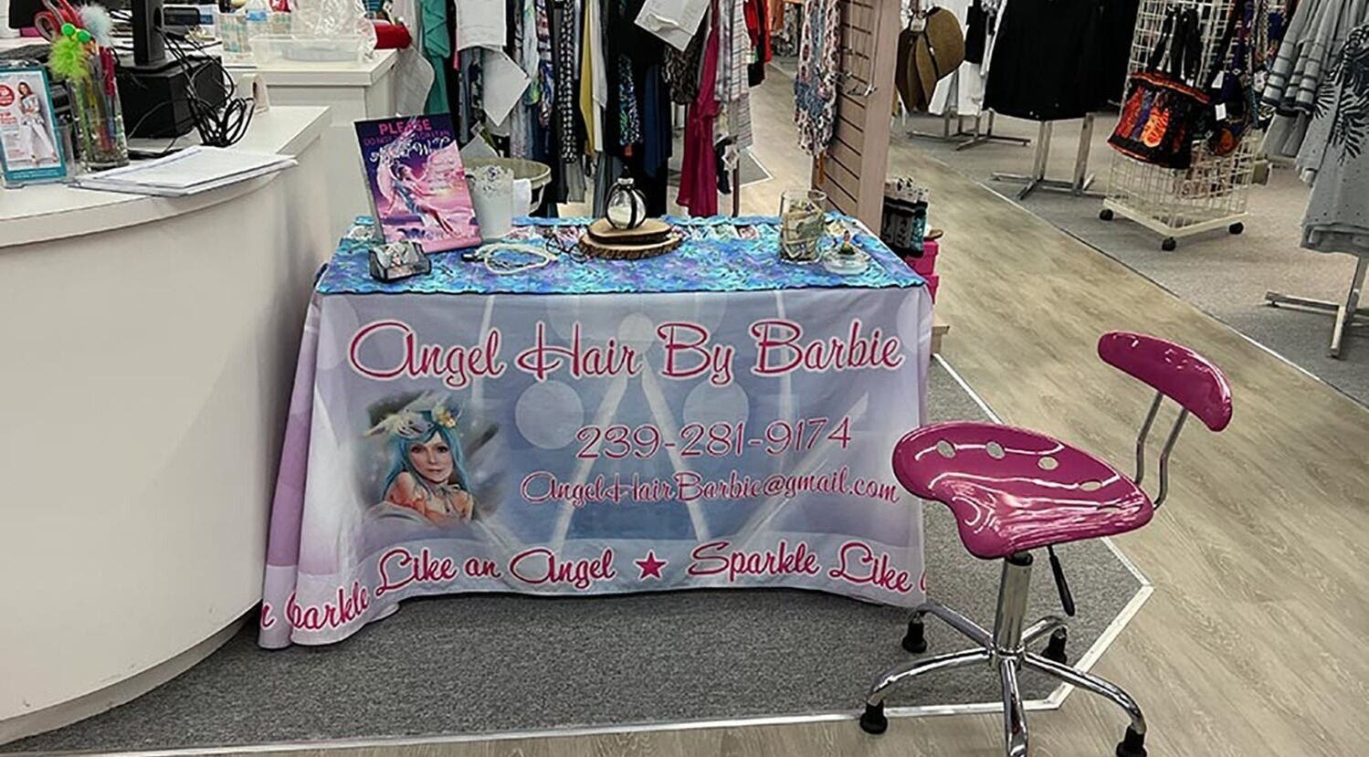 AngelHairBarbie-SanibelFit4Life booth with branded tablecloth in Sanibel, Florida, US.