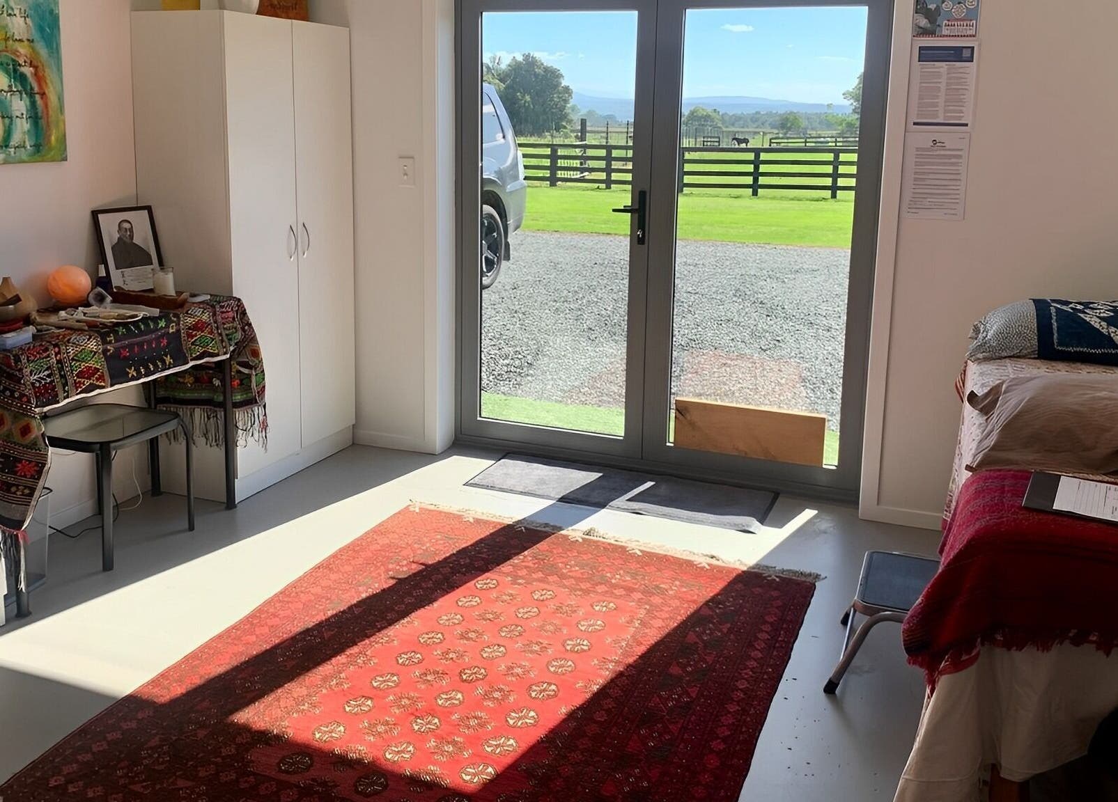 Bright therapy room at Catherine Lupton Therapies, Tapapa, Waikato, NZ, with comfortable setup and scenic view.