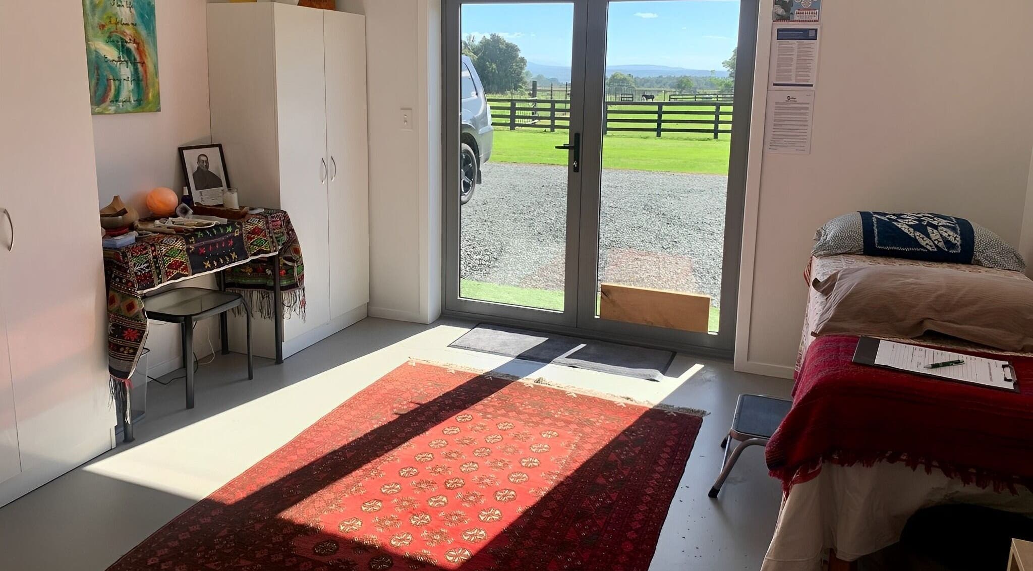 Bright therapy room at Catherine Lupton Therapies, Tapapa, Waikato, NZ, with comfortable setup and scenic view.