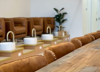 Elegant seating at Sweetling Nails and Spa, Ottawa, Ontario, CA, featuring plush chairs and sleek pedicure stations.