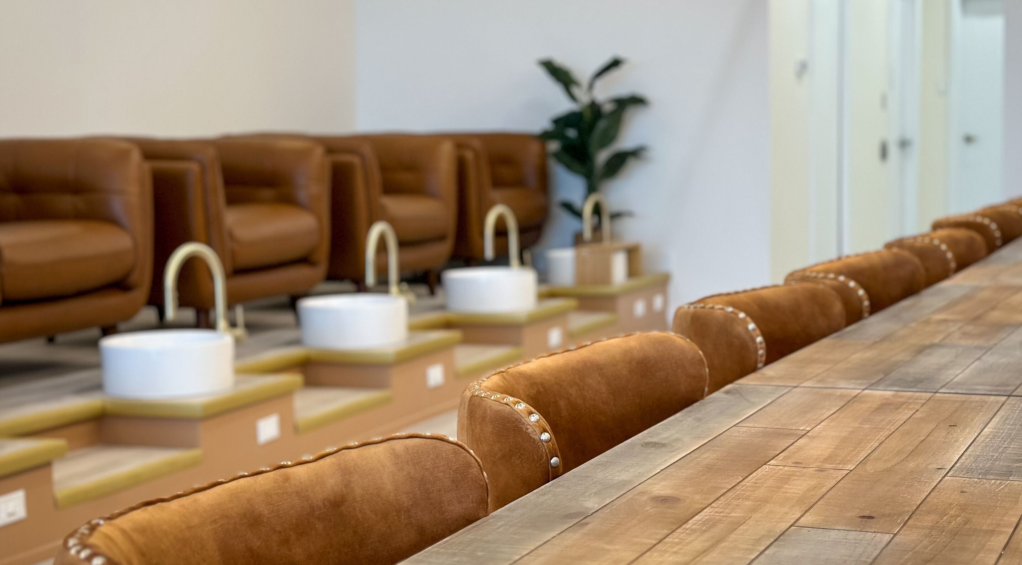 Elegant pedicure seating at Sweetling Nails and Spa in Ottawa, Ontario, CA with plush leather chairs.