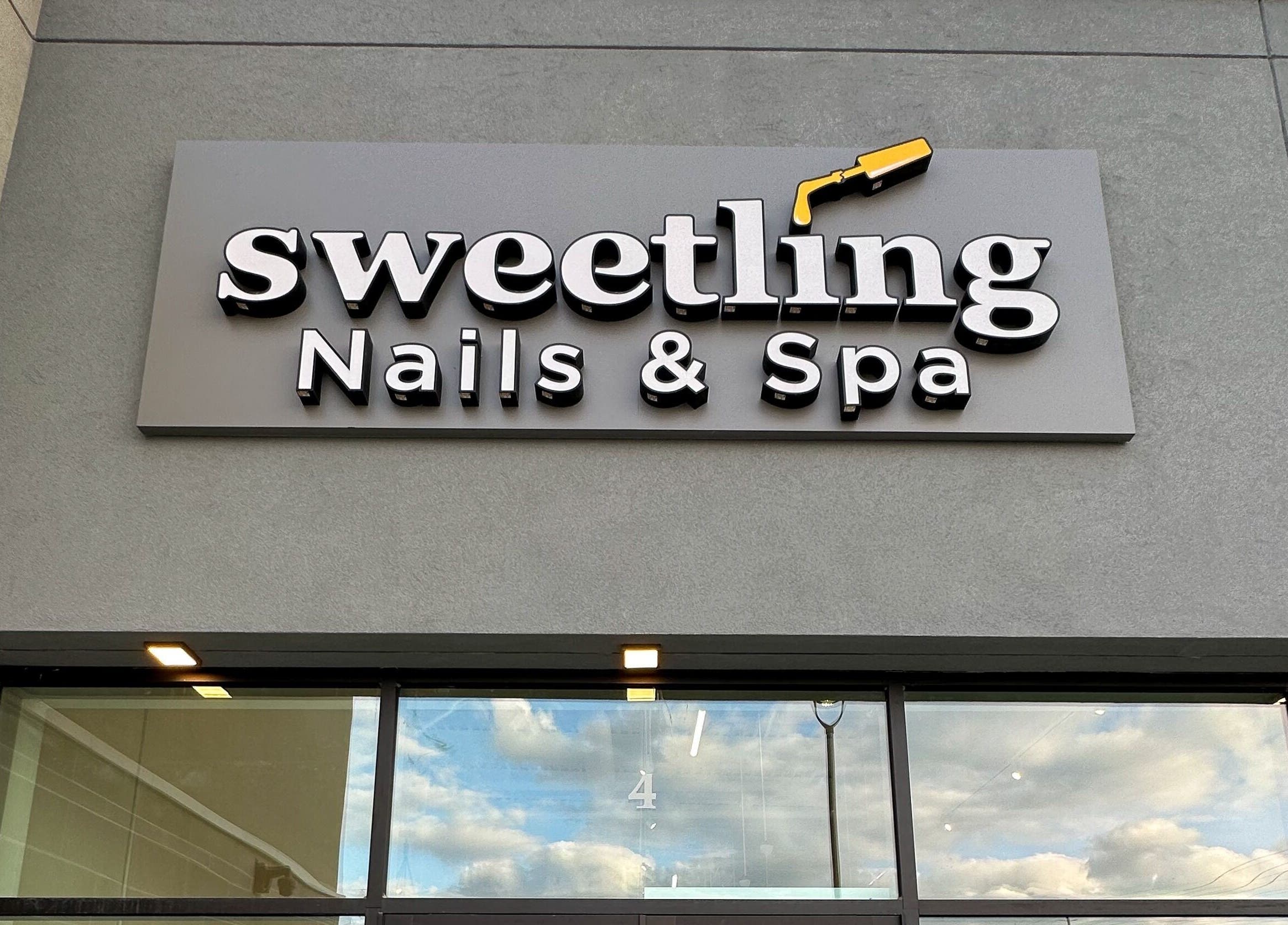 Exterior sign of Sweetling Nails and Spa in Ottawa, Ontario, CA, showcasing modern design and welcoming vibe.
