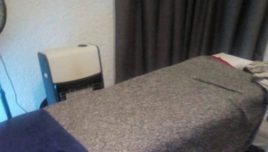 Cozy massage bed setup at Devine Relaxation Massage Studio, Cape Town, Western Cape, ZA.