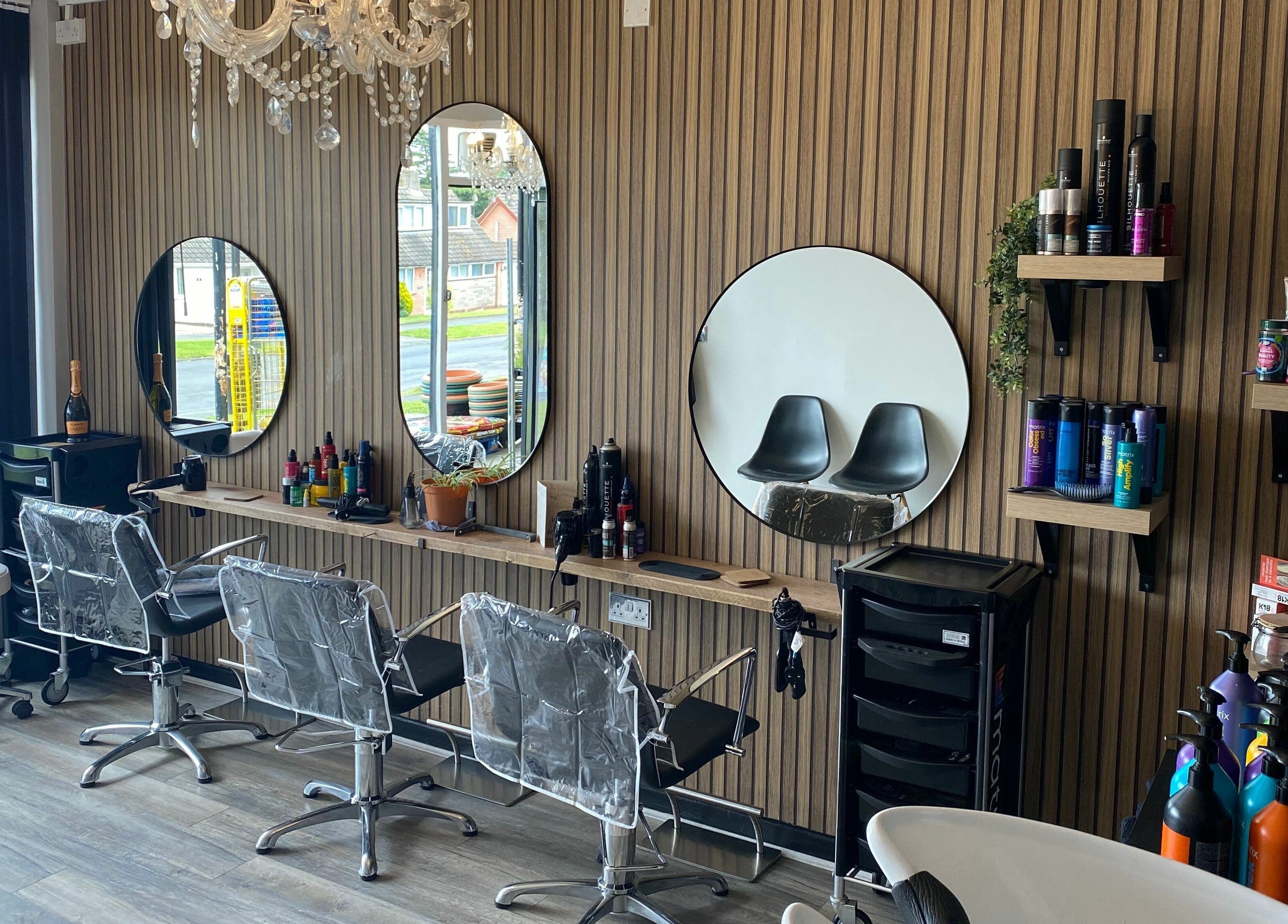 Elegant salon interior at Dy9 Design in Stourbridge, England, GB featuring stylish mirrors and chairs.