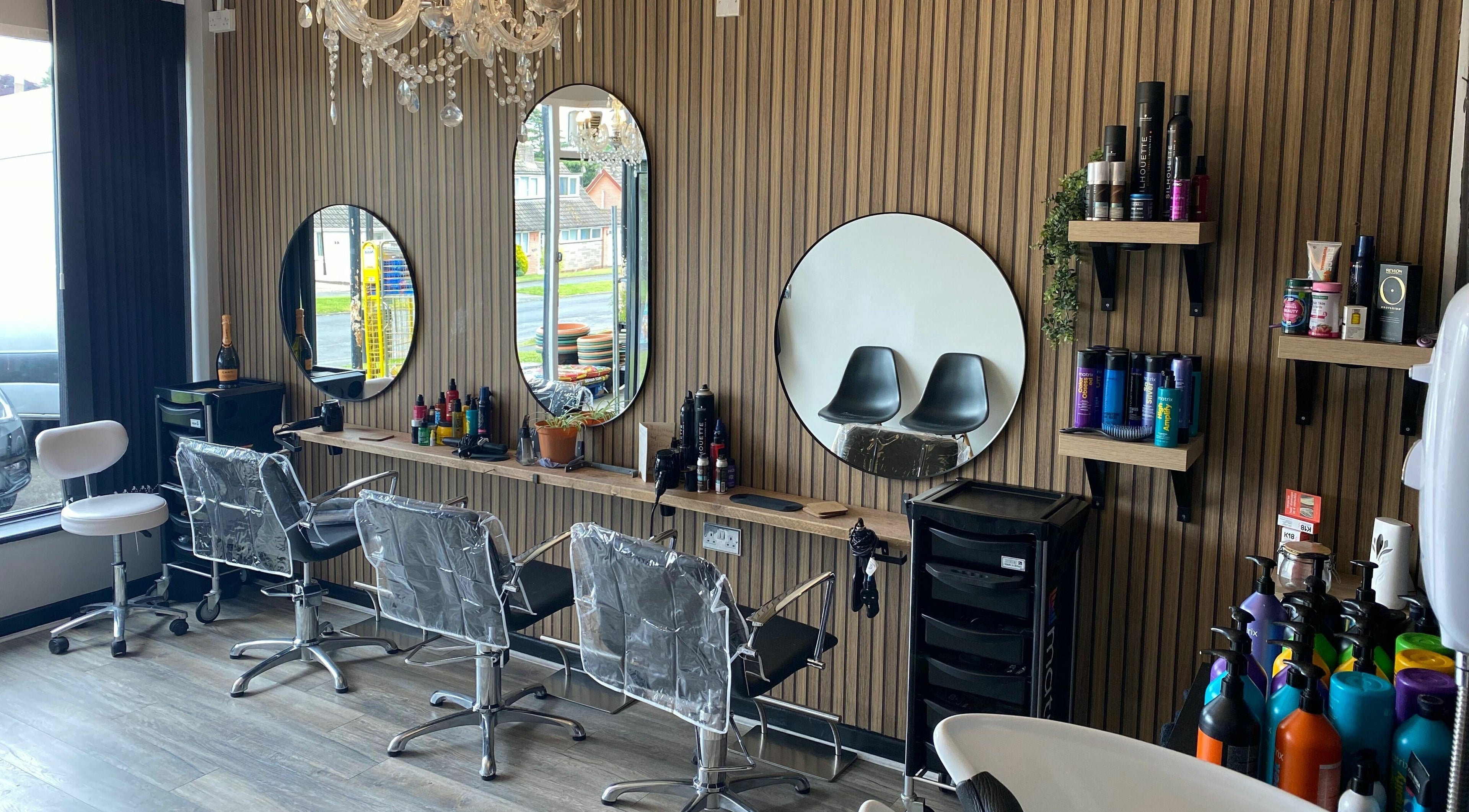 Elegant salon interior at Dy9 Design in Stourbridge, England, GB featuring stylish mirrors and chairs.