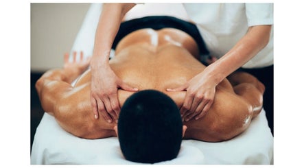 Therapist providing a relaxing back massage at Mend - Holistic Therapy in Banstead, England, GB.