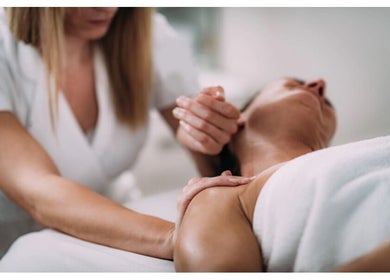 Therapist at Mend - Holistic Therapy giving a relaxing massage in Banstead, England, GB for wellness.